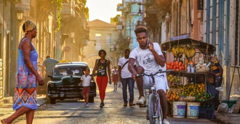 Man riding bicycle along the street