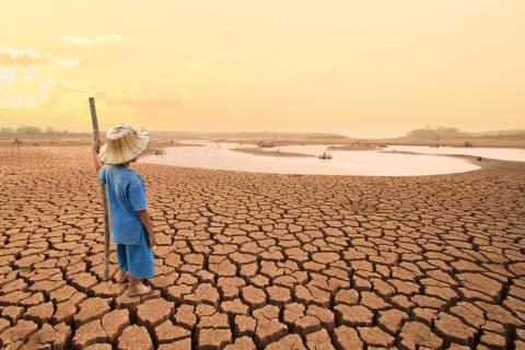 Boy standing in desert _climate action