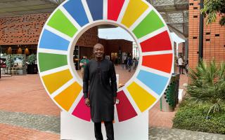 Man standing in front of SDG wheel